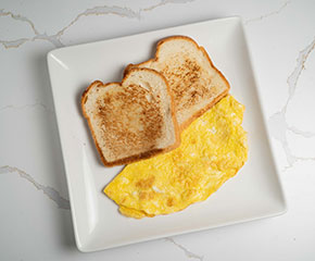 Plain egg served with fresh bread